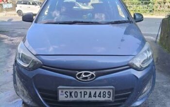 An i20 Sports, old model, manufactured in 2013, with all documents proper, 70k km running, well-maintained, and single-used, is for sale in Sikkim.