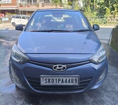 An i20 Sports, old model, manufactured in 2013, with all documents proper, 70k km running, well-maintained, and single-used, is for sale in Sikkim.
