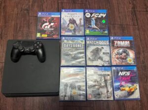 PS4 slim for sale with CDs.